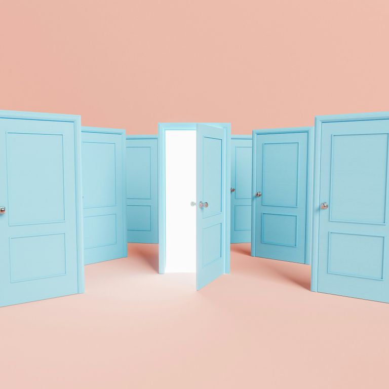 Several light blue doors with one open door revealing a bright white light, representing finding a way forward in counselling and therapy
